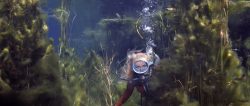 Valerie Taylor,
swimming through weeds in fresh water sink hole, Piccaninny Ponds, South Australia